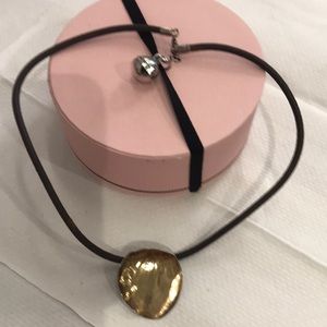 Tous sterling leather shocker cord abstract Lilly pad pendant